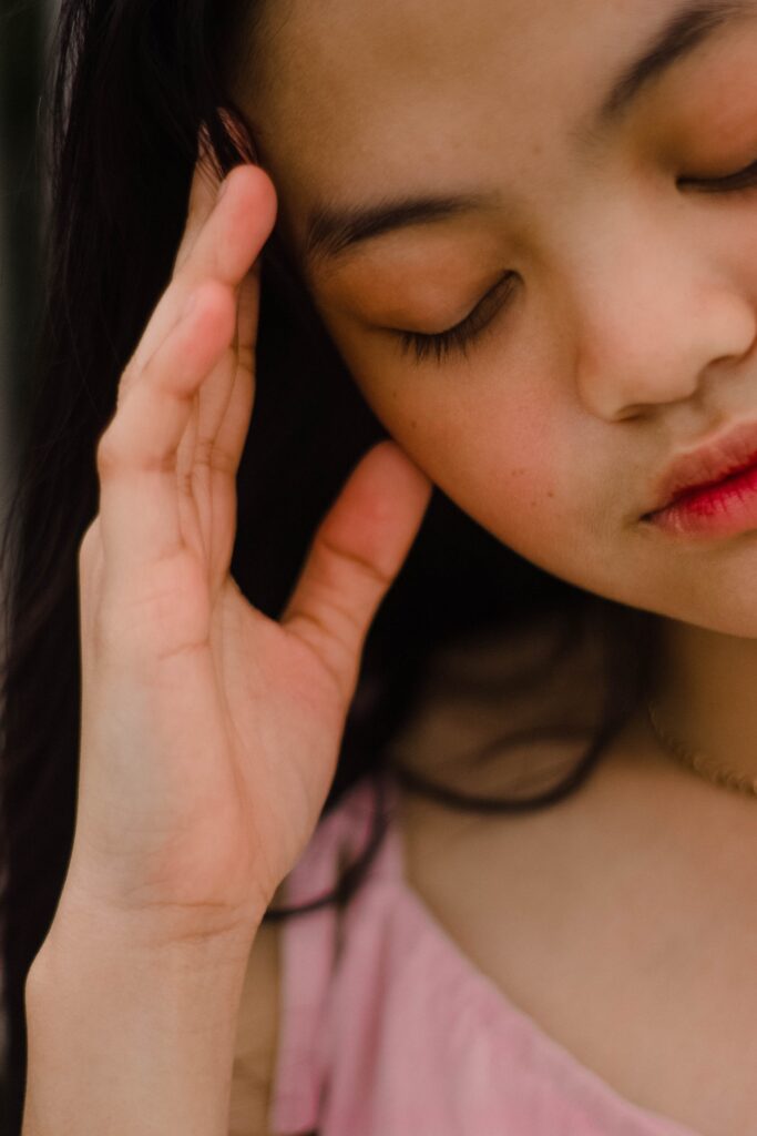 Girl holding head